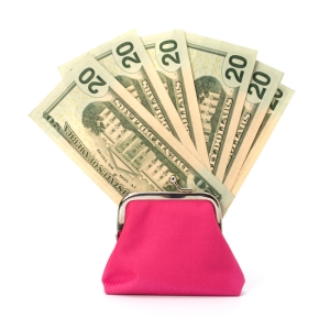 Glamour purse fill with money isolated on white background