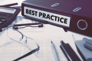 Office folder with inscription Best Practice on Office Desktop with Office Supplies. Business Concept on Blurred Background. Toned Image.