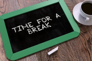 Time for a Break Handwritten by White Chalk on a Blackboard. Composition with Small Green Chalkboard and Cup of Coffee. Top View. 3D Render.