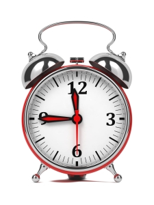 Red Old Style Alarm Clock. Isolated on White.