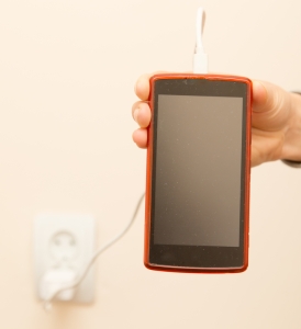 cell phone charging in your hand